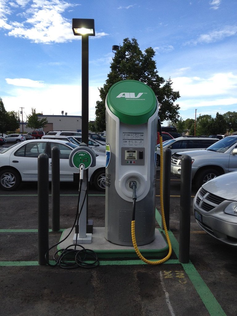 Home EV wall charger with a tethered charging cable