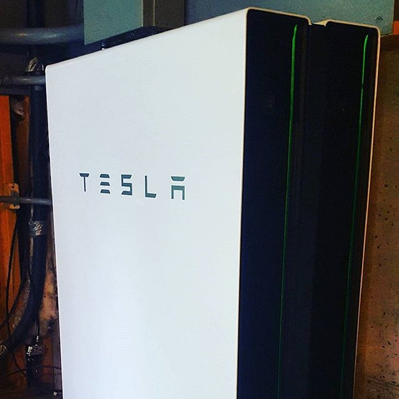Wall-mounted home battery storage unit in a utility space